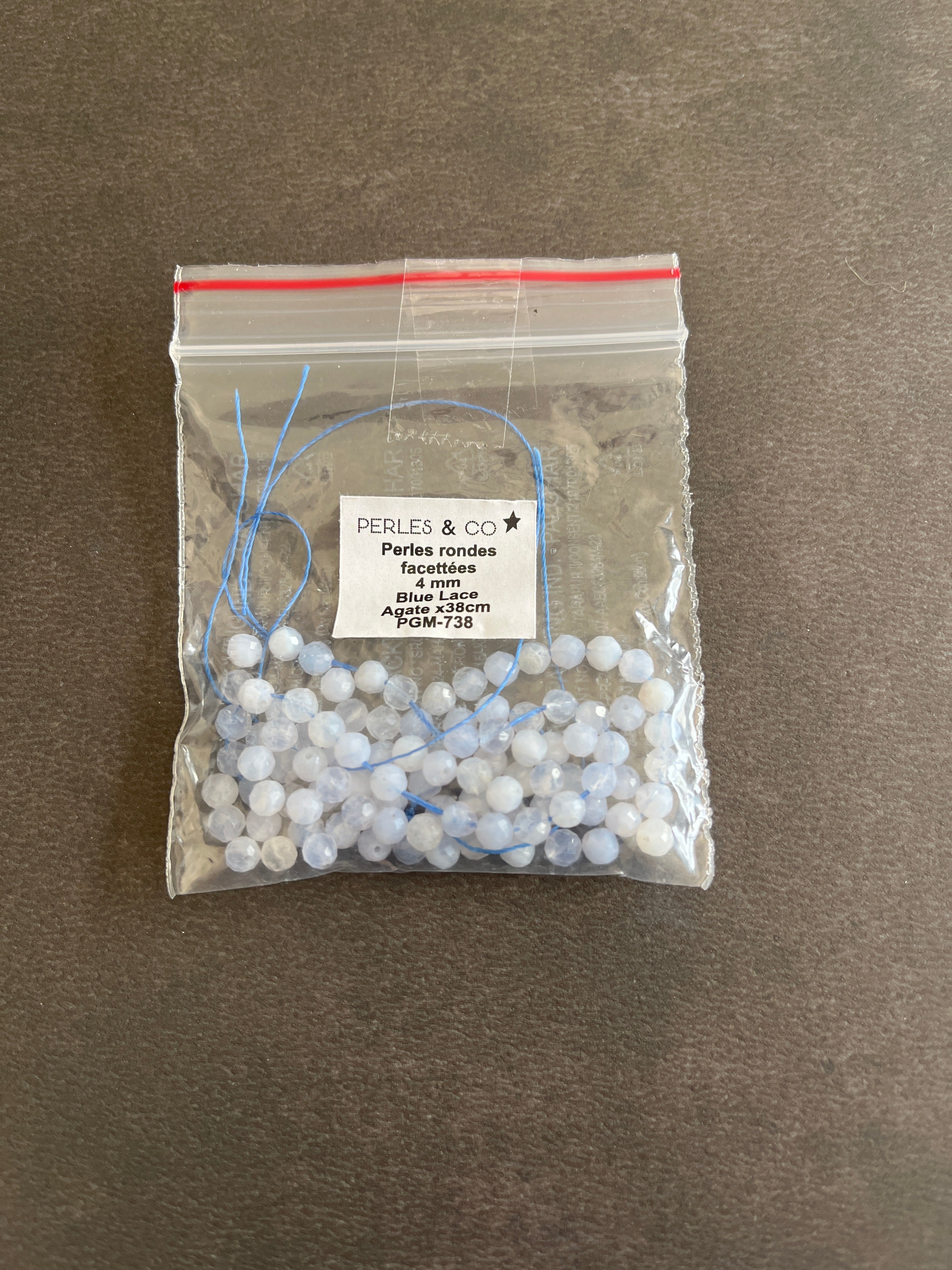 1 fil Agate bleue facettes 4mm
