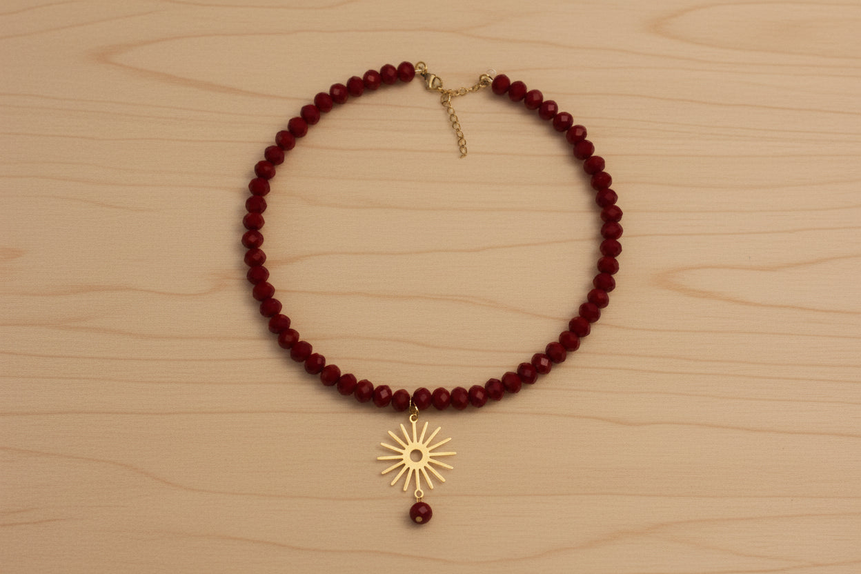 Collier rouge et soleil