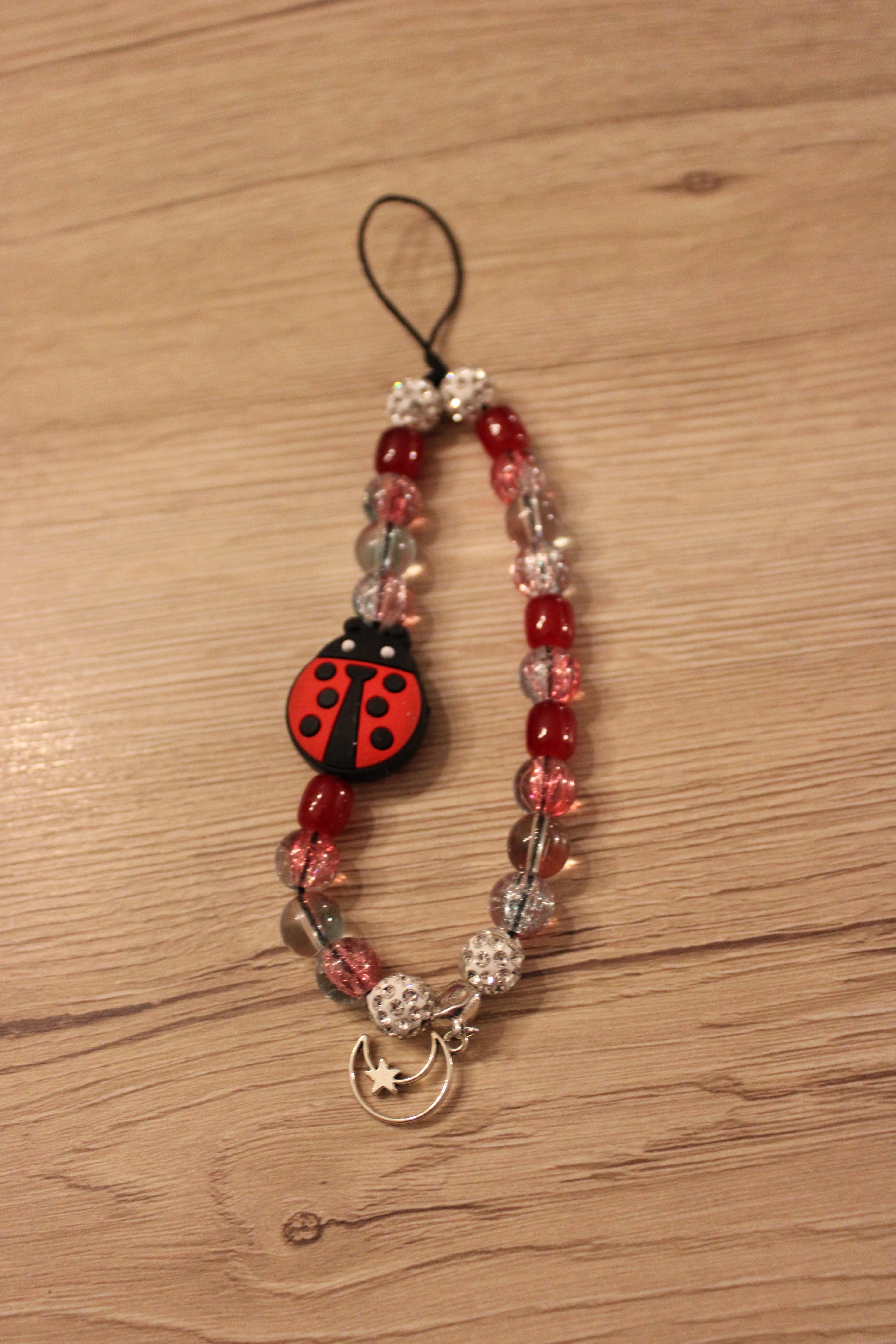 Bijou de téléphone et liseuse coccinelle