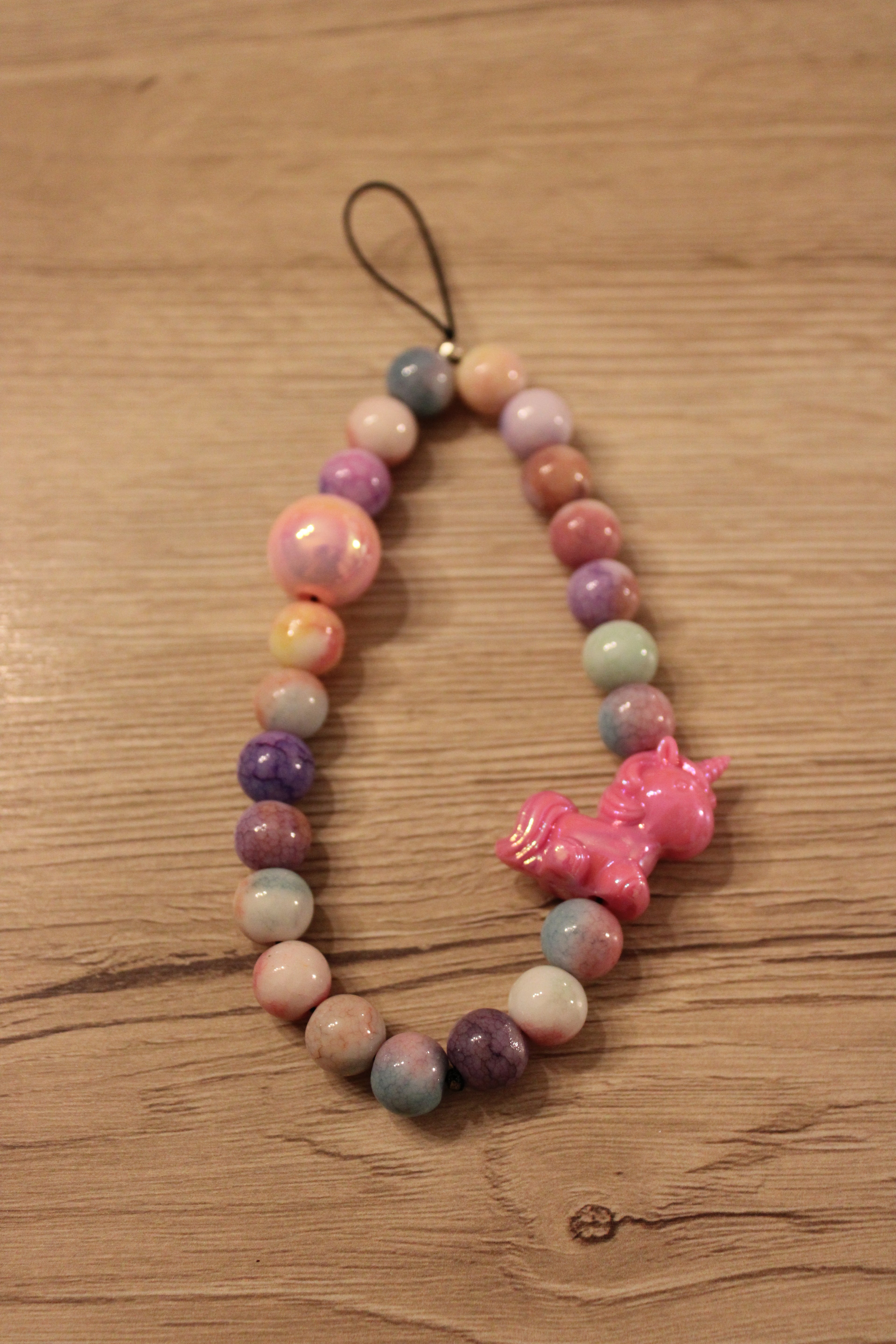 Bijou de téléphone et liseuse licorne