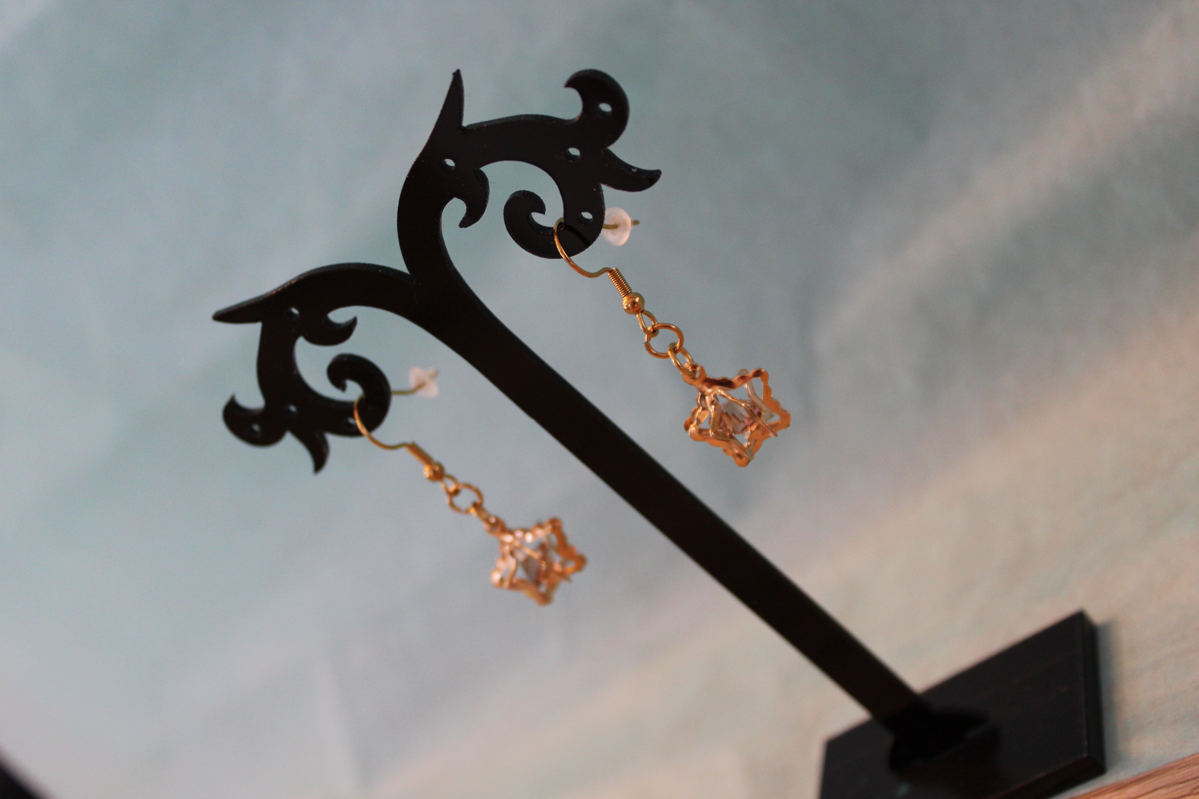 Boucles d'oreilles dorées étoiles 3D