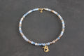 Collier bleu transparent champagne chat doré