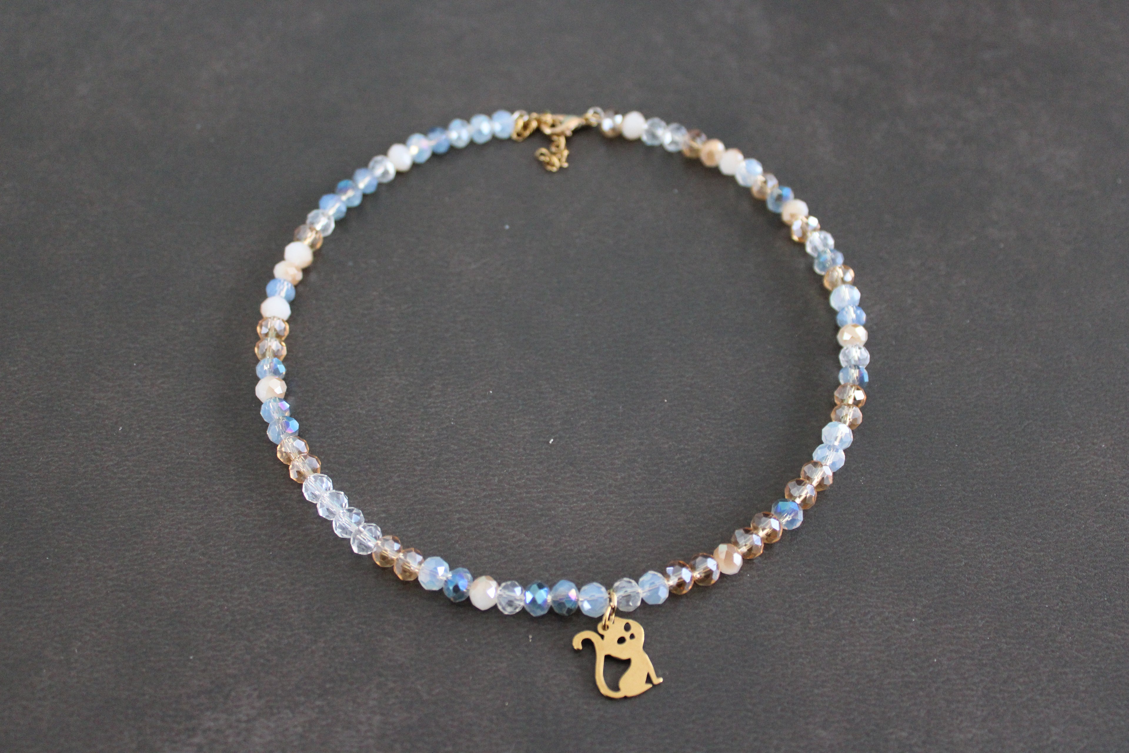 Collier bleu transparent champagne chat doré