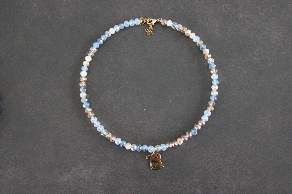 Collier bleu transparent champagne chat doré