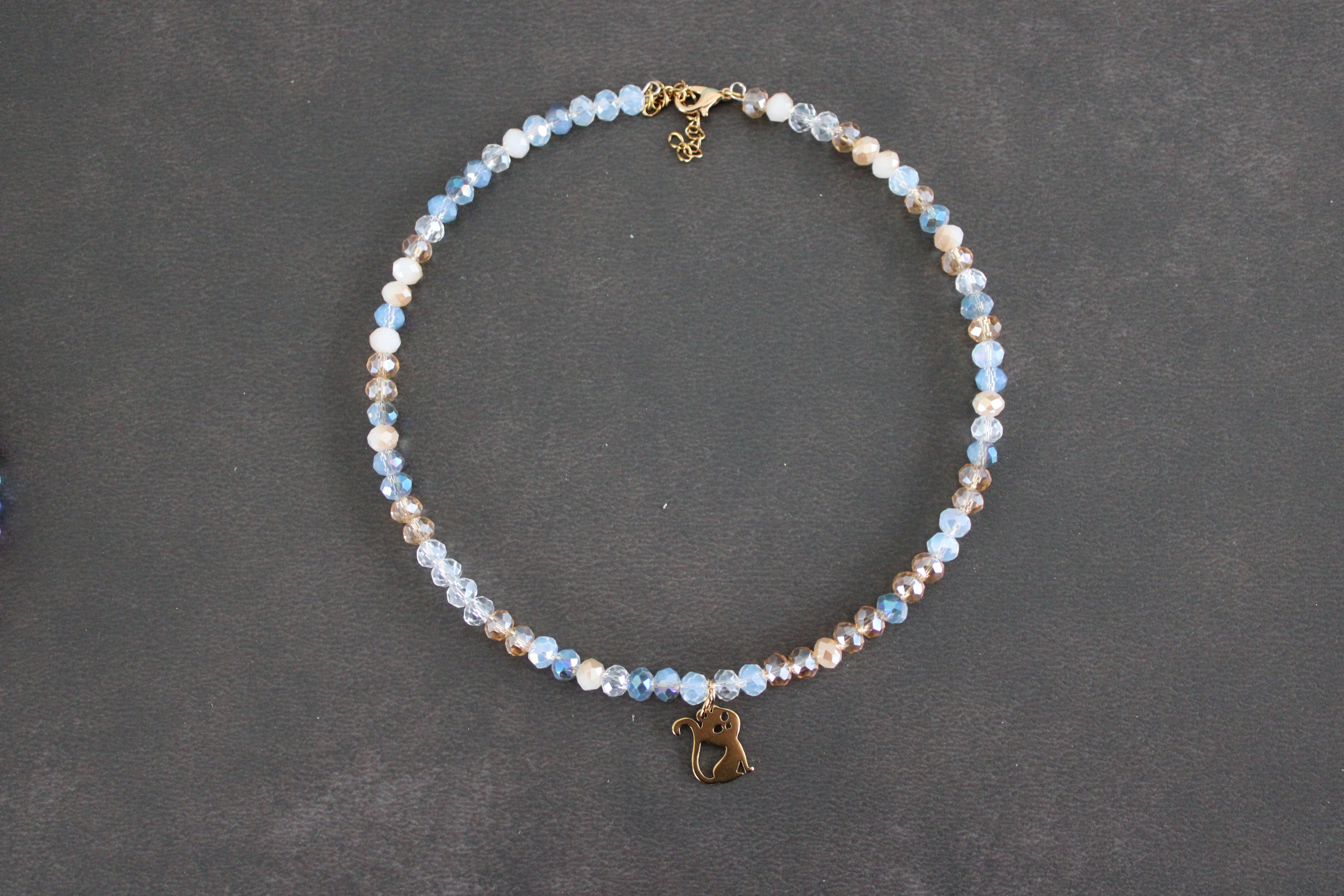 Collier bleu transparent champagne chat doré