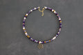 Collier violet et doré avec fleur dorée